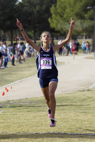 Foothill’s Karina Haymore raises her arms while crossing the finish line during the Su ...