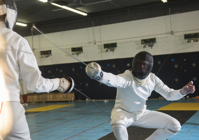 Bishop Gorman fencer Zachary Zeller fences with an opponent during practice inside the Fenci ...