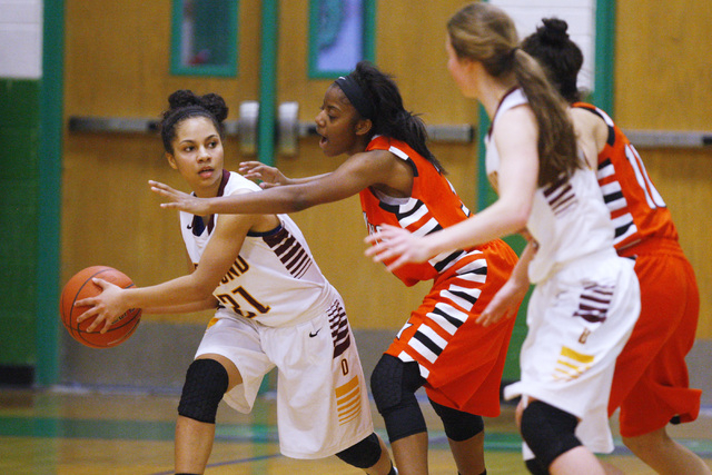 Chaparral guard Taij Criss-Felton defends Dimond guard Shameah Jones (21) during their game ...