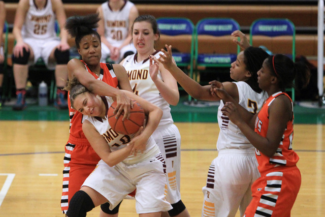 Chaparral center Jade Hazelton fouls Dimond guard Ne’chelle Martinez during the Gator ...