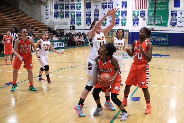 Dimond’s Lexi Wingert defends Chaparral guard Taij Criss-Felton during their game at t ...