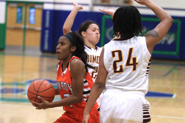 Chaparral guard Taij Criss-Felton drives between Dimond guards Tiffany Jackson and Dejha Can ...