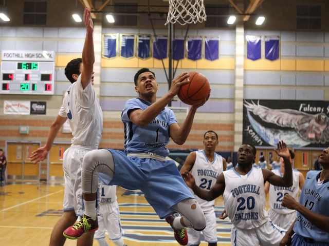 Canyon Springs guard Jordan Davis drives past Foothill guard Colin Curi on Tuesday. Davis ha ...