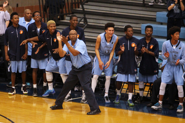 Canyon Springs head coach Freddie Banks and his bench cheer as they pull away from Foothill ...