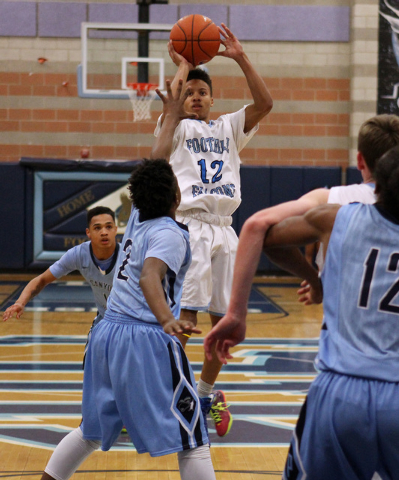 Foothill guard Eric Johnson shoots over Canyon Springs guard Antonio Longmyers on Tuesday. C ...