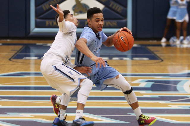 Canyon Springs guard Jordan Davis drives past Foothill guard Kevin Woodland on Tuesday. Davi ...