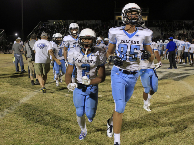 Foothill’s Bobby Merritt, left, and Tyler Jacob celebrate their 34-30 defeat of Basic ...