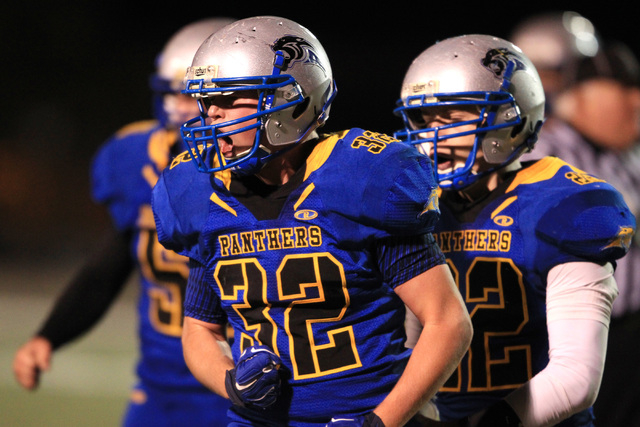 Pahranagat Valley’s Christian Higbee celebrates a play against Spring Mountain during ...