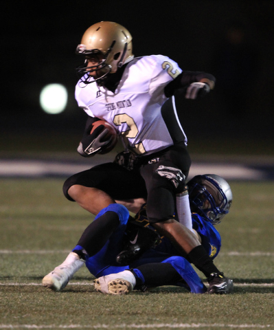 Pahranagat Valley cornerback Jordan Cryts brings down Spring Mountain’s Norman Crawfor ...