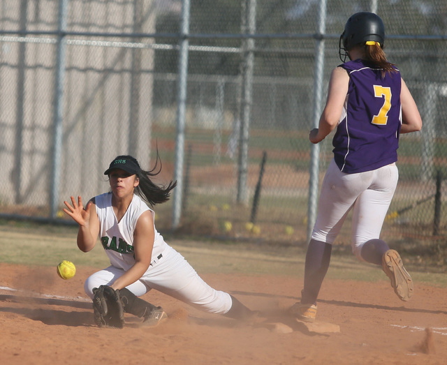 Rancho’s Sammi Llamas, left, tries to record an out as Durango’s Cheyanne Haas r ...