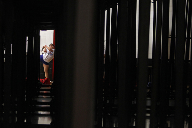 A Valley cheerleader limbers up before their game against Las Vegas Thursday, Feb. 5, 2015, ...