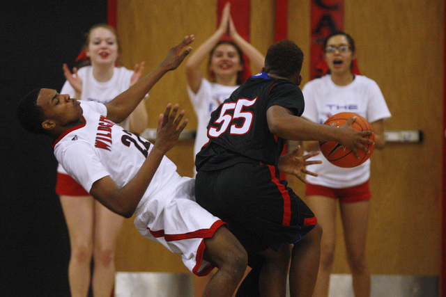 Valley guard Darrion Daniels fouls Las Vegas guard Patrick Savoy during their "V Game&q ...