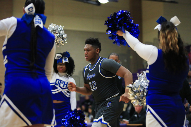 Desert Pines senior Jalen Graves (12) runs onto the court during the Class 3A boys regional ...