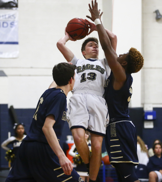 Lake Mead’s Josh Thorell (13) goes up for a shot as Rancho Solano’s John Gorgol ...