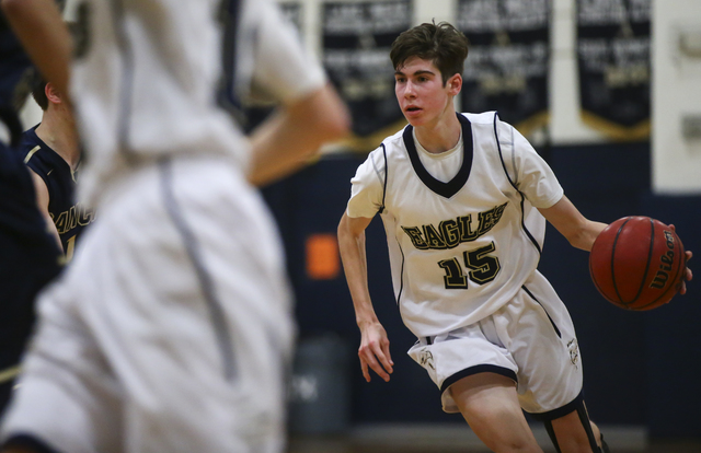 Lake Mead’s Shay Rutledge (15) drives to the basket during a basketball game at Lake M ...