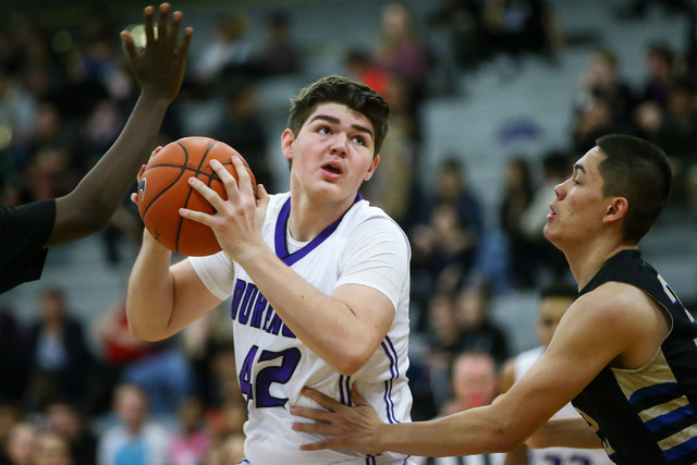 Durango forward Jovan Lubura (42) looks for an open pass during a basketball game against Si ...