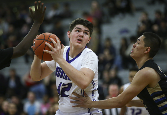 Durango forward Jovan Lubura (42) looks for an open pass during a basketball game against Si ...