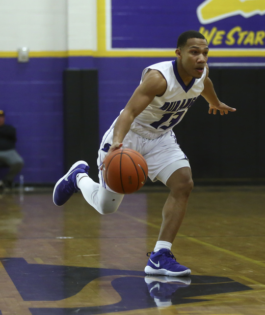 Durango guard Demetrius Valdez (13) drives the ball against Sierra Vista during a basketball ...