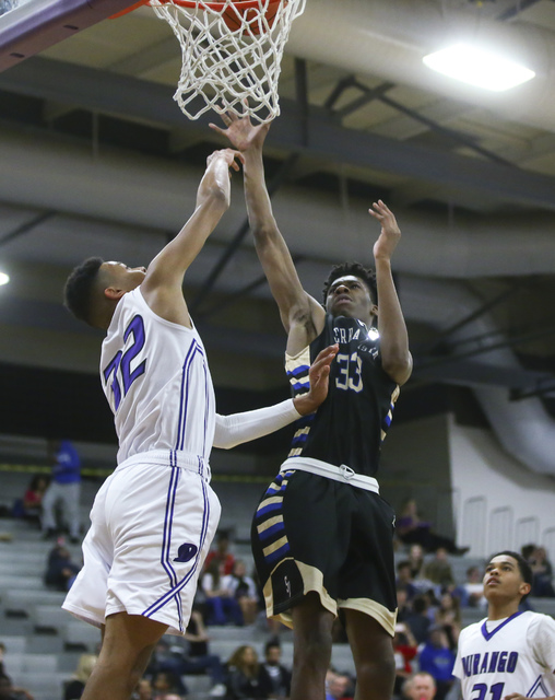 Sierra Vista forward Jalen McFadden (33) sends up a shot over Durango forward Jeremie Portuo ...