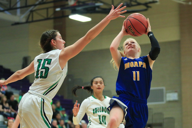 Moapa Valley freshman Kaitlyn Anderson (11) shoots the ball during the Class 1A girls region ...