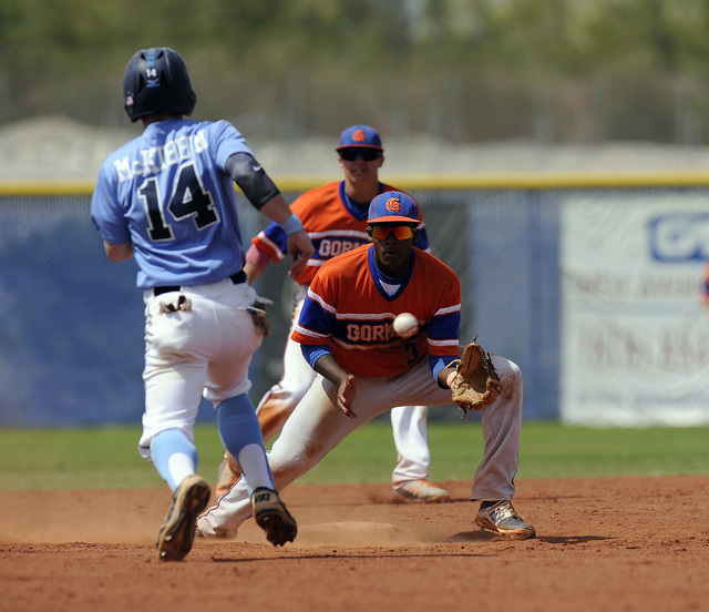 Bishop Gorman second baseman Andrew Newson awaits a throw as Josh McKibbin steals second bas ...