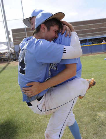 Centennial shortstop Jake Portaro, left, and designated hitter William Loucks embrace after ...