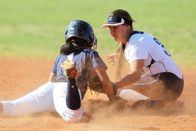 Shadow Ridge’s Samaiya Montgomery slides safely into second under the tag of Centennia ...