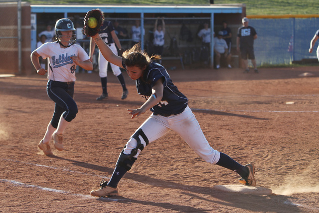 Shadow Ridge first baseman Justin Garganese saves an errant throw to force out Centennial&#8 ...