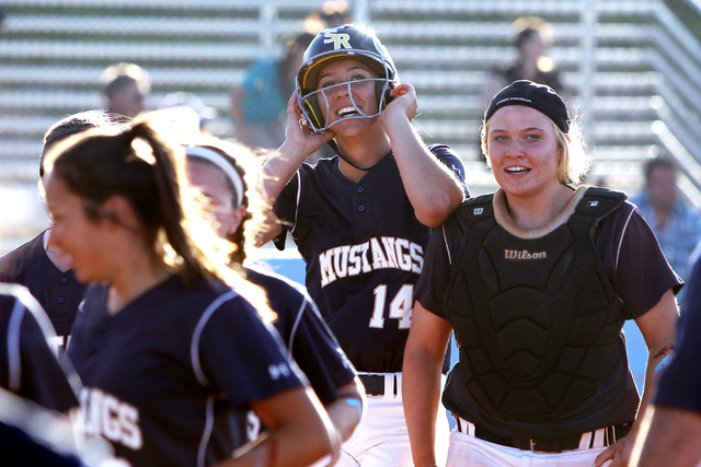 Shadow Ridge’s Shelbi Denman celebrates scoring the winning run against Centennial dur ...