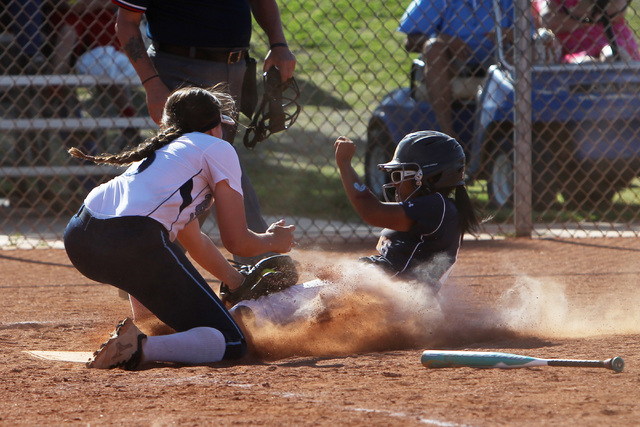 Shadow Ridge’s Samaiya Montgomery is tagged out by Centennial’s Stephanie Day du ...