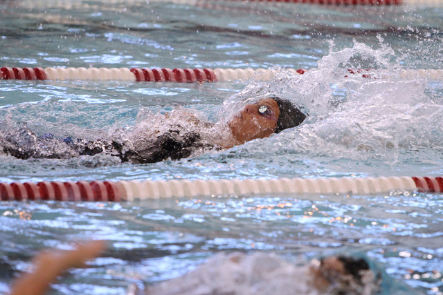 Abby Richter competes in the girls 100-yard backstroke during the Sunrise and Sunset Region ...