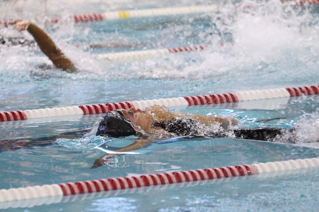 Abby Richter competes in the girls 100-yard backstroke during the Sunrise and Sunset Region ...