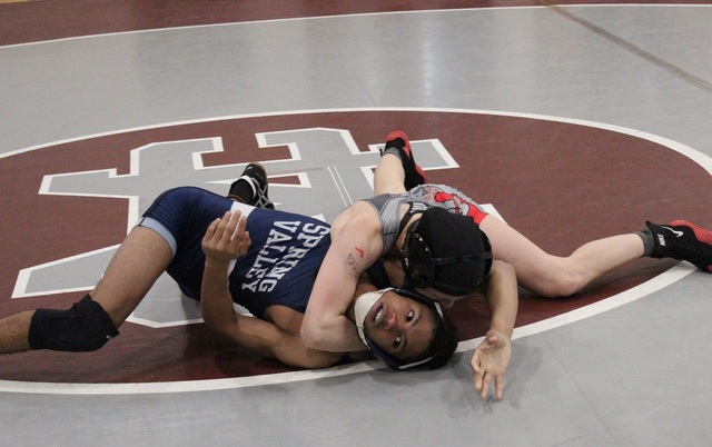 Arbor View 106-pounder Peyton Prussin works on top of Spring Valley’s Bryan Hermida in ...