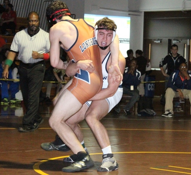 Shadow Ridge’s John Scarpati (right) goes to lift Legacy’s Justin Tanner during ...