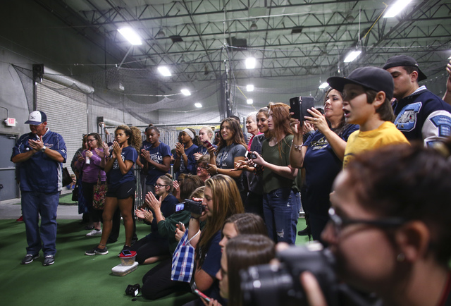 People take photos as Las Vegas area high school softball players gather to sign their natio ...