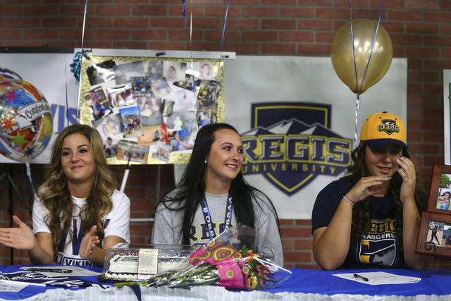 Las Vegas area high school softball players gather to sign their national letters of intent ...