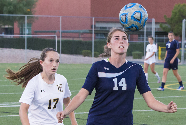 Centennial’s McKenna Stratton (14) heads a ball away from Faith Lutheran’s Maggi ...