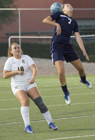 Centennial’s Marcella Brooks (7) goes up for a header over Faith Lutheran’s Broo ...