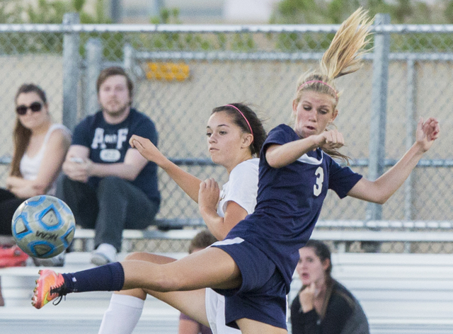 Centennial’s Quincy Bonds (3) fights for a loose ball with Faith Lutheran’s Mar ...