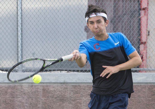 Wesley Harris from Coronado High School hits a shot during a tennis match at Liberty High Sc ...