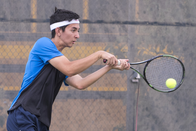 Wesley Harris from Coronado High School hits a shot during a tennis match at Liberty High Sc ...