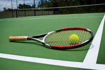 Tennis Racket and Ball on court