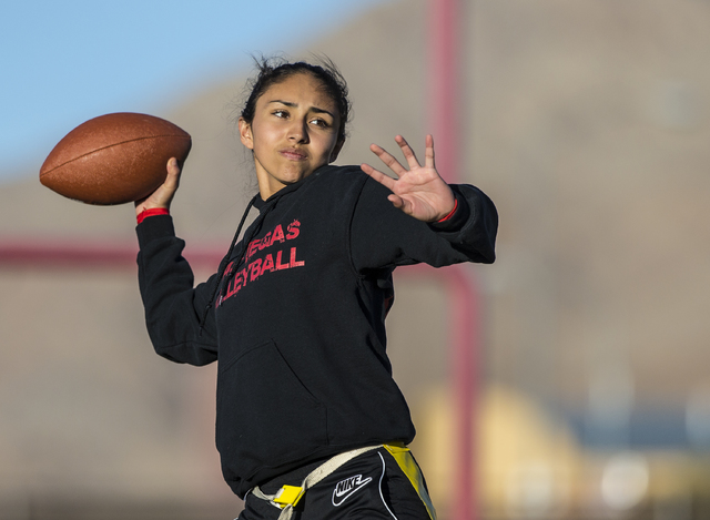 Wildcat quarterback Sabrina Saldate runs drills during flag football practice at Las Vegas H ...