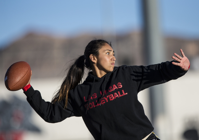 Wildcat quarterback Sabrina Saldate warms up during flag football practice at Las Vegas High ...