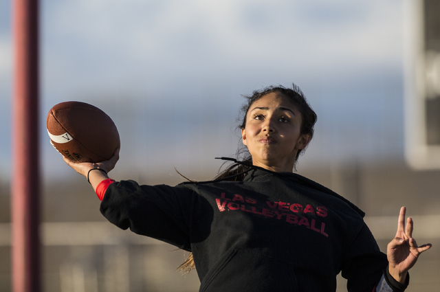 Wildcat quarterback Sabrina Saldate runs drills during flag football practice at Las Vegas H ...