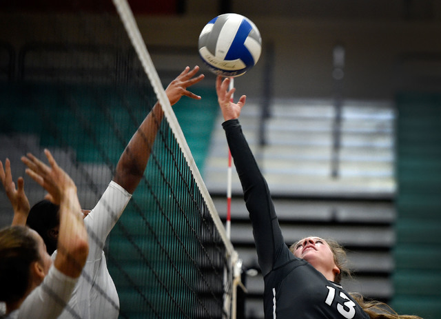 Palo Verde’s Mia Sadler, right, tips the ball against Faith Lutheran during a high sch ...