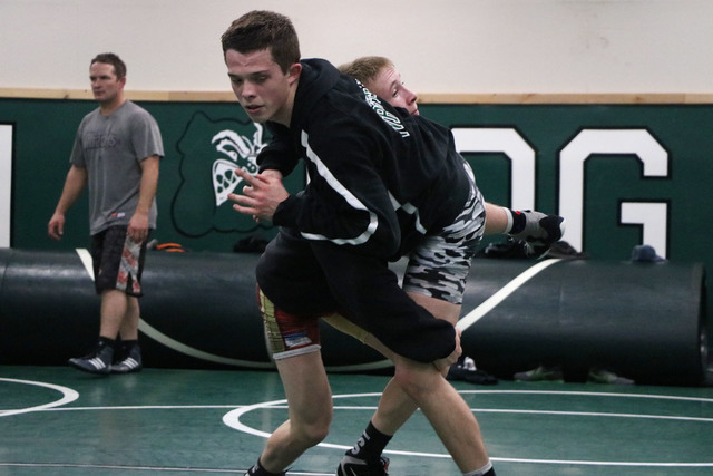 Virgin Valley wrestler Ty Smith, right, takes down Jacob Baird at practice, Virgin Valley Hi ...