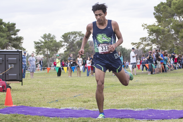 Omar Rubio, from Green Valley High School, finishes first during the Regional 4A Sunrise Boy ...