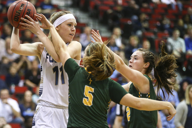 Bishop Manogue guard Malia Holt (C) (5) and forward Maddie Camacho (2) defend against Foothi ...