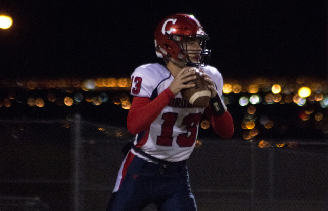 Coronado High School quarterback Landen Rowland (13) drops back for a pass during their prep ...